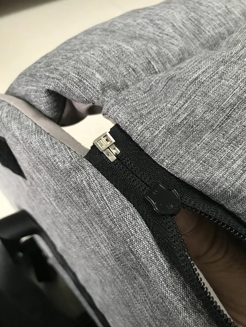 Close-up of grey fabric bag or cushion with black zipper, Carcader product detail